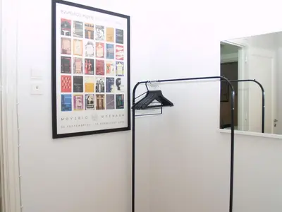 a white refrigerator with a poster on the wall at Artistic Deco Apartment in Athens