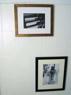 two framed photographs hanging on a white wall at Artistic Deco Apartment in Athens
