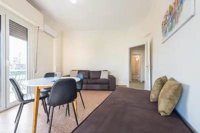 a living room with a table and a couch at Super Paradise Apartments in Athens