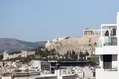 a view of the acropolis of athens from a building at Renovated 3 bedroom apt with Acropolis View in Athens
