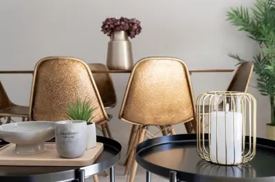 a dining room with chairs and a table with a vase at Renovated 3 bedroom apt with Acropolis View in Athens