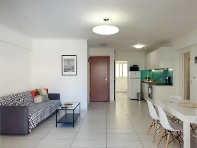 a living room with a couch and a table at KYMA Apartments - Athens Acropolis 13 in Athens