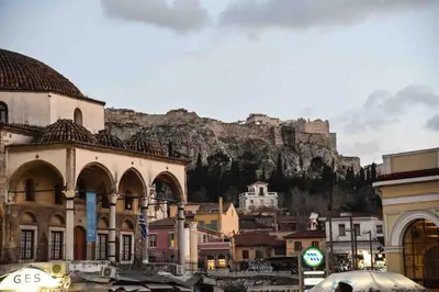 a view of a city with a mountain in the background at Ulysses Apartments Monastiraki in Athens