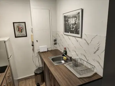 a kitchen with a sink and a counter top at Ulysses Apartments Monastiraki in Athens