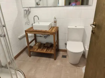a bathroom with a sink and a toilet at Ulysses Apartments Monastiraki in Athens