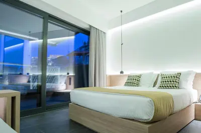 a bedroom with a bed and a large window at Athens Lodge by Athens Prime Hotels in Athens