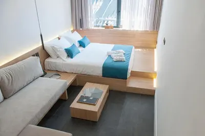 a small room with a bed and a couch at Athens Lodge by Athens Prime Hotels in Athens