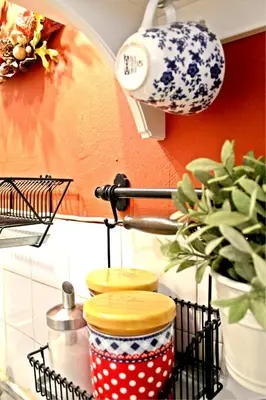 a rack with three cups on a kitchen counter at By the Acropolis, In the heart of Plaka! in Athens
