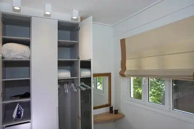 a room with a mirror and a window at Skoufa Apartment in Athens