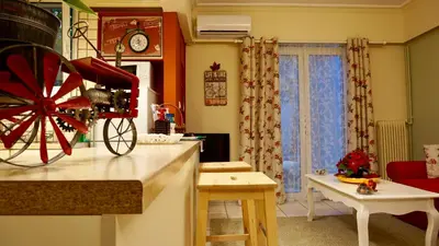 a kitchen with a red wagon on the counter at Star Parthenon Apartment in Athens