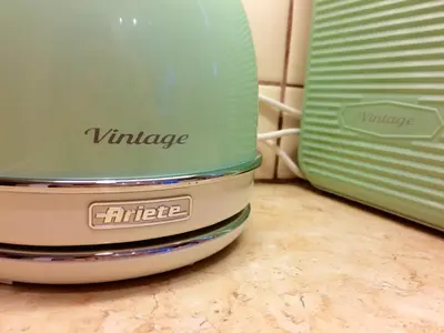 a green and white juicer sitting next to a toaster at Star Parthenon Apartment in Athens