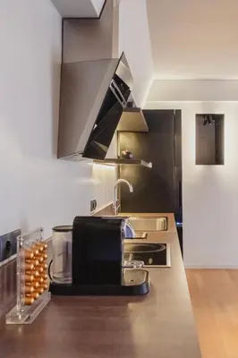 a kitchen with a sink and a counter top at Elliniko Luxury Residence by First Class Properties in Athens