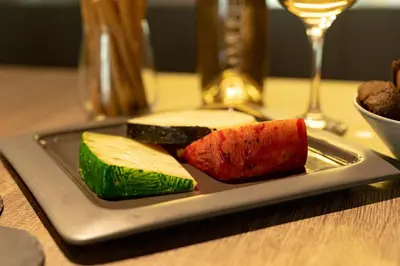 a plate with different types of food on a table at Elliniko Luxury Residence by First Class Properties in Athens