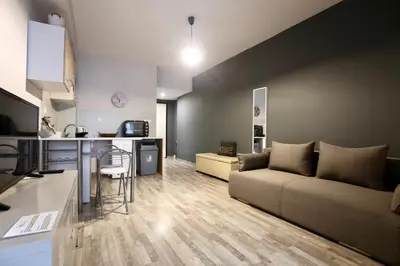 a living room with a couch and a table at GK Ermou Str in Athens