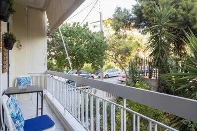 a balcony of a house with a view of a street at Glyfada Riviera Home in Athens