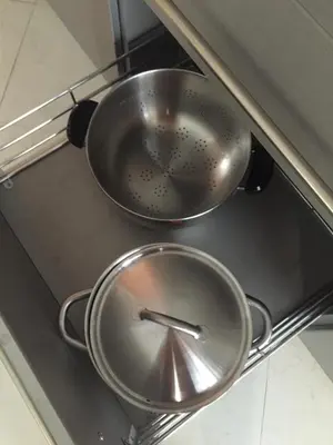 two pans sitting on top of a stove at Glyfada Riviera Home in Athens