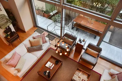 an overhead view of a living room with a couch and chairs at Villa Amaryllis in Athens