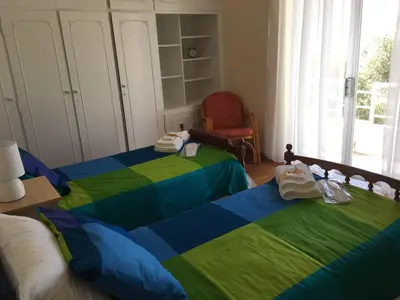 a bedroom with two beds with towels on them at Apartment in Markopoulo center in Markopoulo