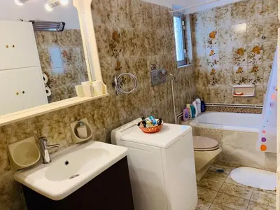 a bathroom with a sink and a toilet and a tub at Apartment in Markopoulo center in Markopoulo