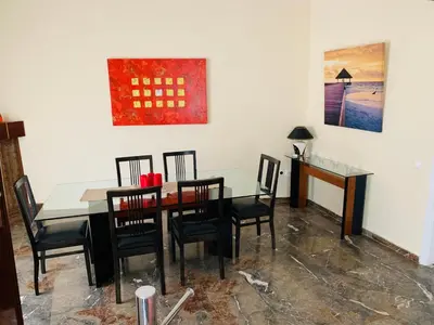 a dining room with a table and chairs at Apartment in Markopoulo center in Markopoulo