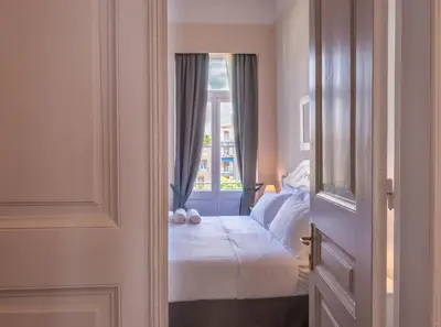 a bedroom with a bed and a window at Palladian Home in Athens