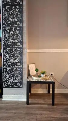 a table with two plants on it in a room at Ermou & Athinas Suites in Monastiraki in Athens