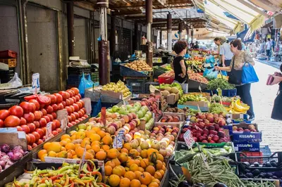 a market filled with lots of fruits and vegetables at Athens Residence Apartments in Athens