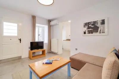 a living room with a couch and a table at Athens Residence Apartments in Athens
