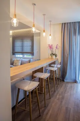 a bar with a row of chairs and a counter at The Athens Insider in Athens