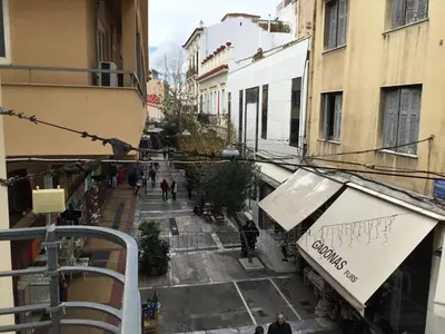 a view of a street with people walking down a street at Athens-Plaka, Peter's House in Athens