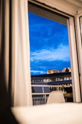 a window with a view of the sky at Acropolis View Deluxe Penthouse & Luxury Apartments in Athens