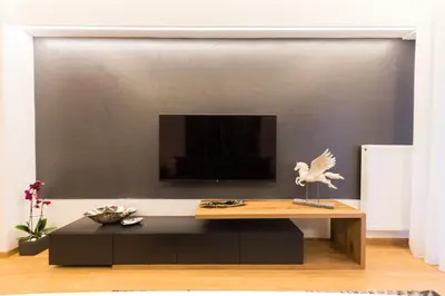 a living room with a coffee table and a tv at Acropolis View Deluxe Penthouse & Luxury Apartments in Athens