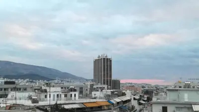 a view of a city with a tall building at Central 6th Floor Studio Near Metro & View&200mbps in Athens