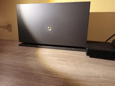 a laptop computer sitting on top of a wooden floor at Central 6th Floor Studio Near Metro & View&200mbps in Athens