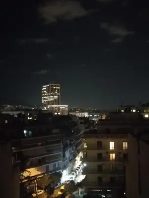 a view of a city at night at Central 6th Floor Studio Near Metro & View&200mbps in Athens