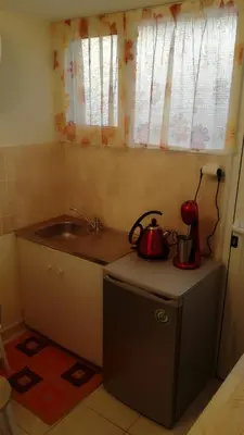 a kitchen with two tea pots and a sink at Central 6th Floor Studio Near Metro & View&200mbps in Athens