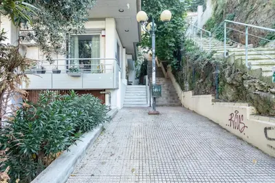 a street with stairs and a street light next to a building at Stadium HiEnd Studio Top Location in Athens