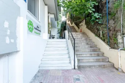 a set of stairs leading up to a building at Stadium HiEnd Studio Top Location in Athens