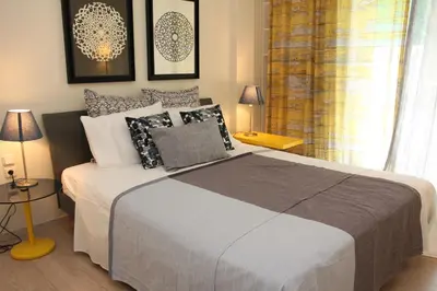 a bedroom with a large bed and a window at Acropolis View Luxury Suite in Athens