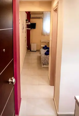 a hallway leading into a room with a room at Zoe's Studio in Athens