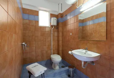 a bathroom with a toilet and a sink at Artemision in Athens