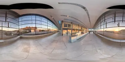 a large building with glass windows and a hallway at Artemision in Athens