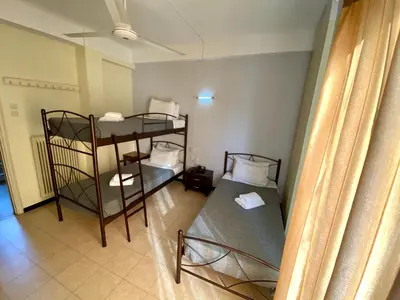 a small room with two bunk beds in it at Artemision in Athens