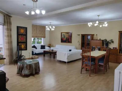a living room with a couch and a table at House,1000m from beach in Lagonissi