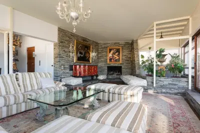 a living room with couches and a fireplace at Exclusive Spacious Apartment with Expansive City Views - ST8 in Athens