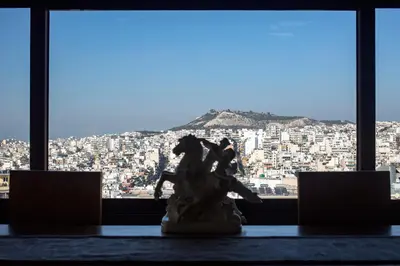 a statue in front of a view of a city at Exclusive Spacious Apartment with Expansive City Views - ST8 in Athens