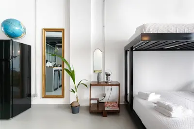 a bedroom with a bed and a mirror at Monastiraki Factory CityCenter- Unspoiled Athens Apartments in Athens