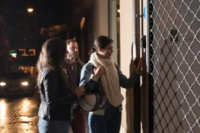 a group of people standing next to a fence at Monastiraki Factory CityCenter- Unspoiled Athens Apartments in Athens