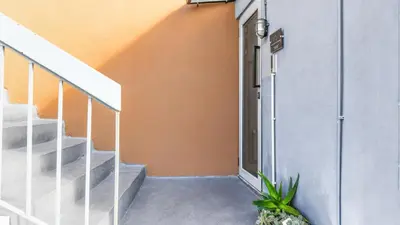 an entrance to a house with a door and stairs at Monastiraki CityCenter Sleepbox- Unspoiled Athens Apartments in Athens