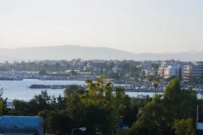 a view of a city with a river and buildings at Golden Sun Hotel in Athens